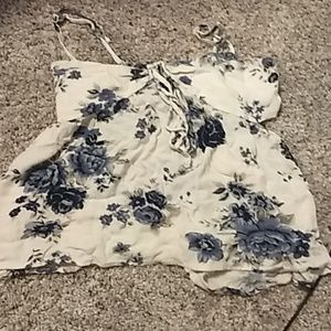 Flowy shirt. With blue flowers and cut sides.